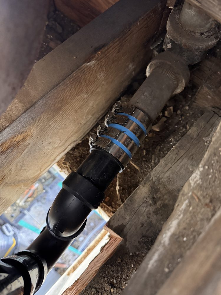 Premier 1 Plumbing repair on a cast iron drain line under a house