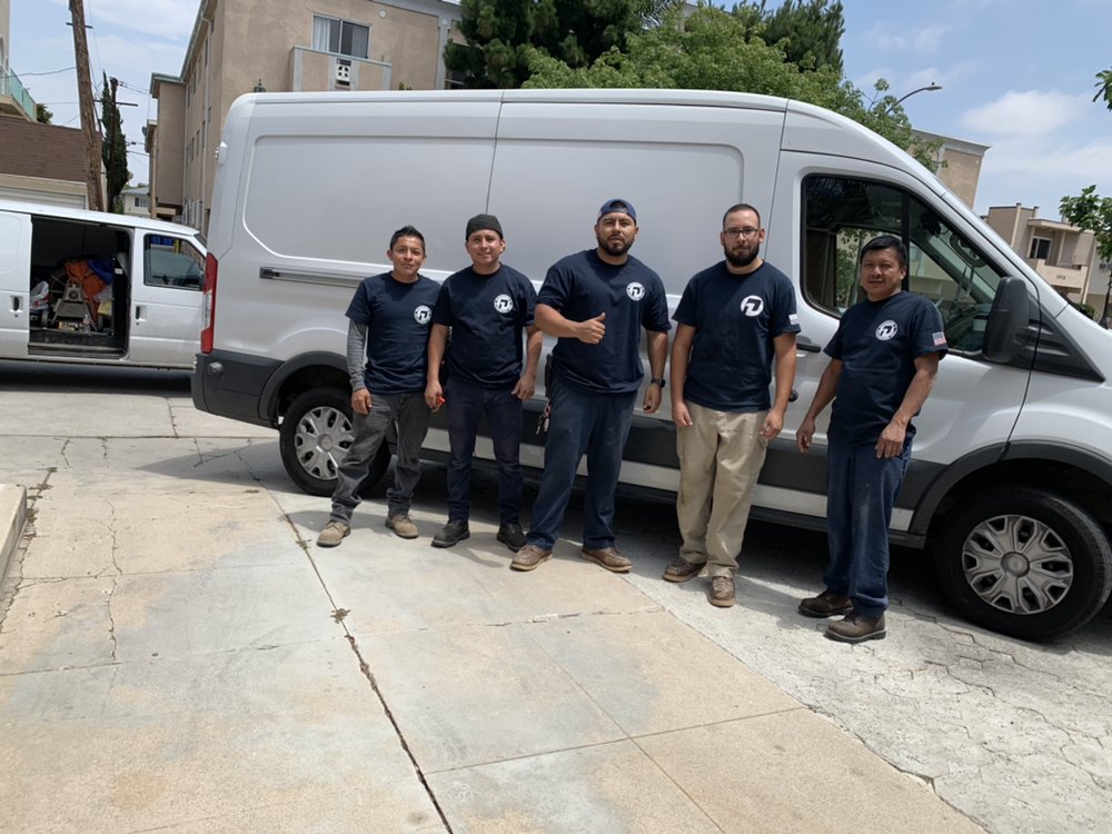 The Premier 1 Plumbing crew standing in front of their service van in Los Angeles County